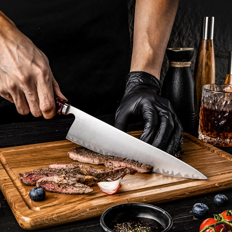 Person cutting steak on a wooden board with a kitchen knife, surrounded by ingredients and drinks.