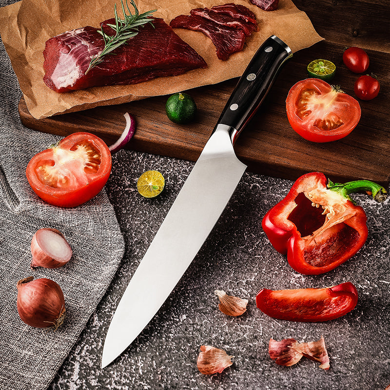 Wooden cutting board with raw meat, german steel hikari knife, and vegetables on a dark surface