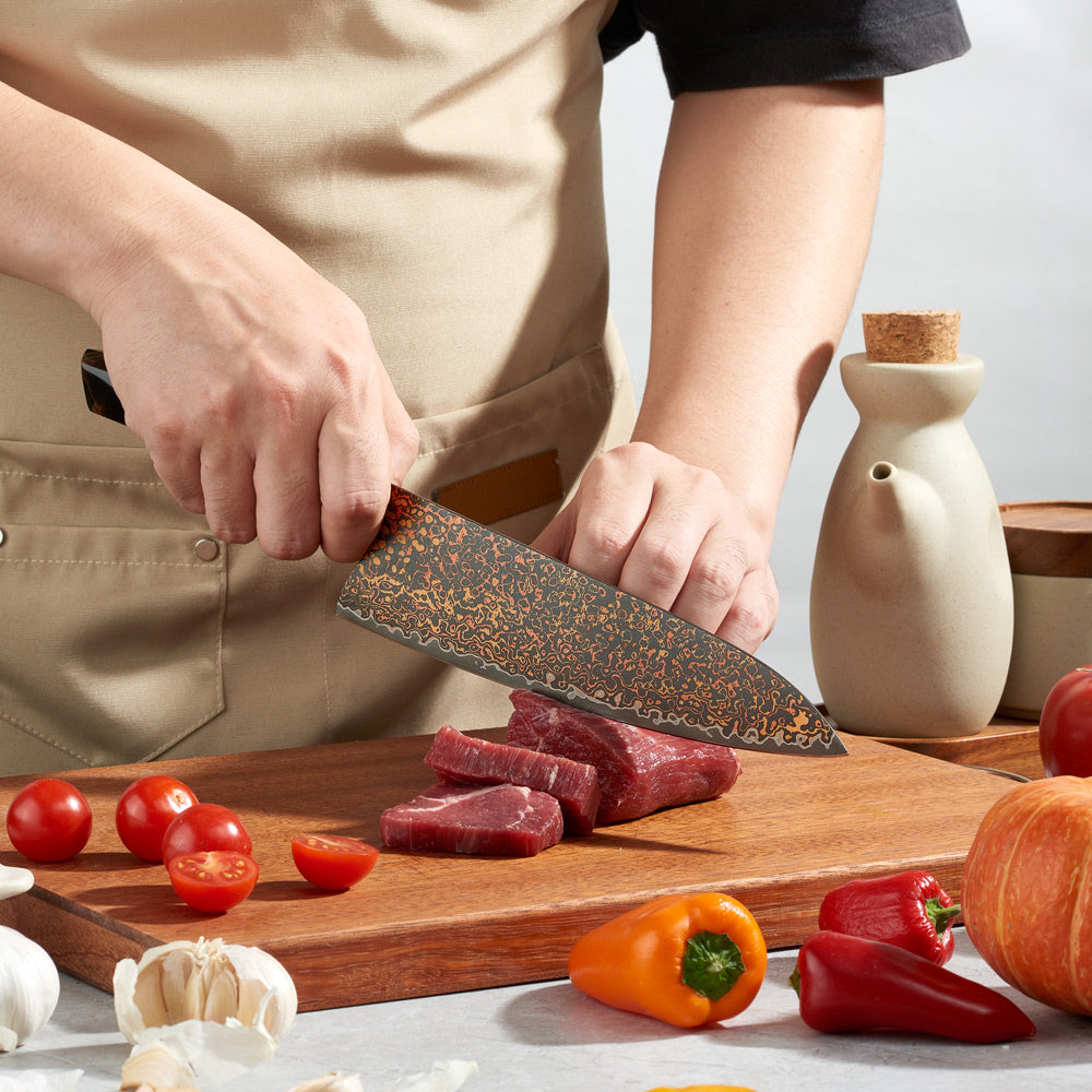 Japanese chef holds damascus knife with copper damascus very sharp and beautiful