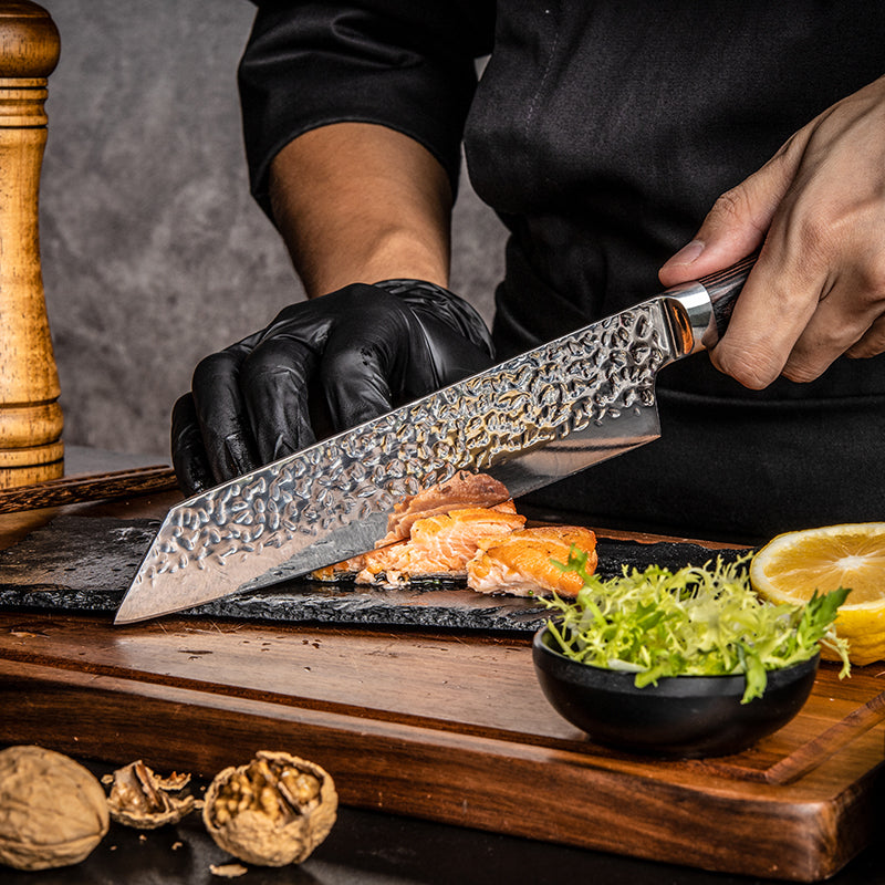 Japanese Chef using a professional Hikari knife to cut food on a wooden cutting board with various ingredients.