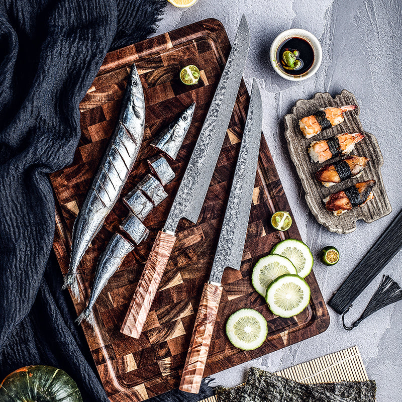 Wooden cutting board with fish, knives, and sushi on a gray surface