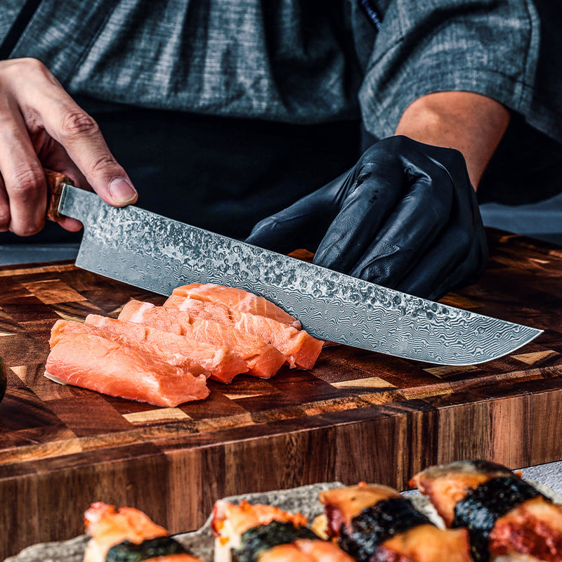 Person cutting salmon with a large knife on a wooden cutting board, with sushi in the background.